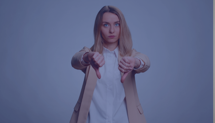 Woman with two thumbs down